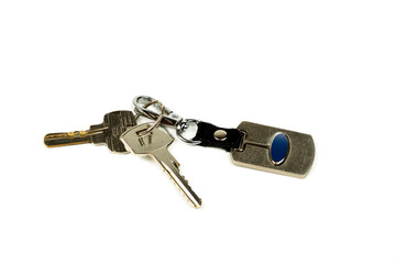 House keys with metal keychain, close-up on white background
