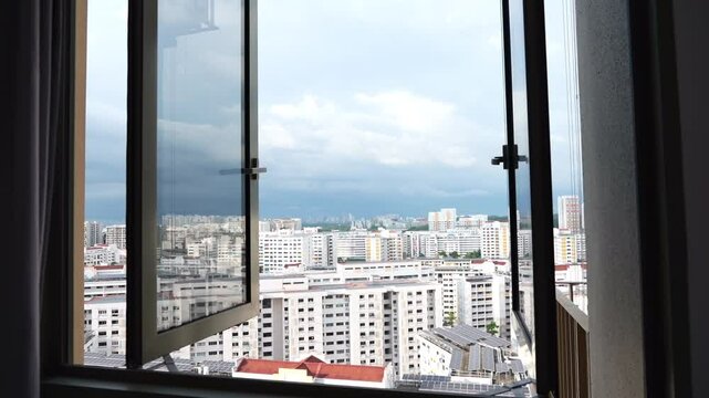 dramatic Time lapse view of city housing estate in Singapore during raining with dark clouds