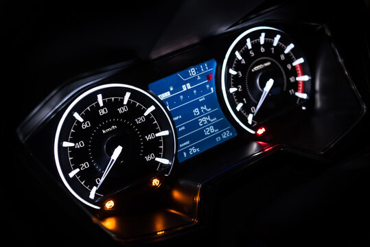 Light with car mileage with black background,number of speed,Odometer of car.