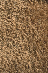 Texture of a brown faux fur as a background.
