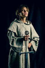 Knighting of a princess. Portrait of a warrior princess with a greatsword.