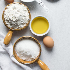Overhead view of mise en place of ingredients for making a vanilla cake, process of making cake