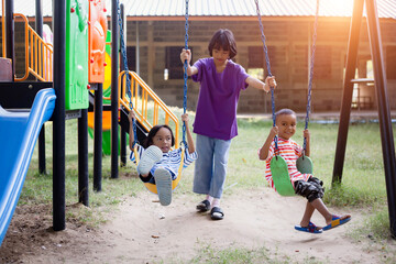 Child on playground. Kids play outdoor.