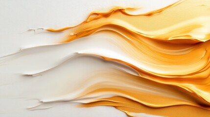 Fototapeta premium A close-up of bold, golden and white textured paint strokes creates an elegant abstract image, depicting movement and elegance in an artistic composition.