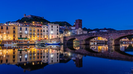 Obraz premium The town of Bosa on the river Temo at blue hour, Sardinia, Italy.