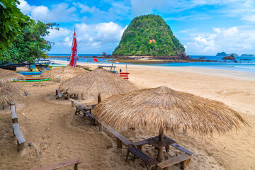 The beautiful Red Island Hill has red soil and is covered in green vegetation in Pesanggaran, Banyuwangi, Indonesia.