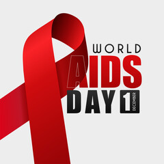 Closeup of red ribbon, World AIDS Day awareness ribbon and text on white background