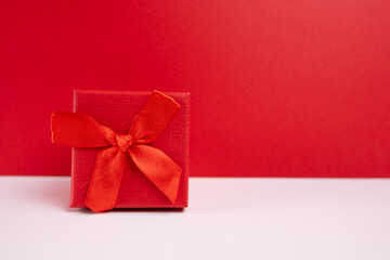 Stylish gift boxes with bow on color background. Valentines day gift for him. Corporate gift concept or birthday. Christmas background