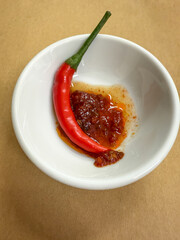 Red Chili Pepper and Sauce in a Bowl