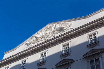 Triangular pediment  of building with sculptures and stucco, Vienna