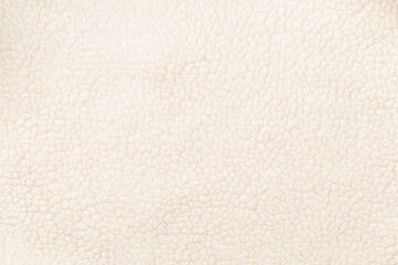White cuddle teddy bear fabric as background, top view