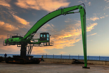 Long Range Excavator waiting for work on the beach