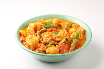 Mix vegetable curry - Indian main course recipe contains Carrots, cauliflower, green peas and beans and served in ceramic bowl