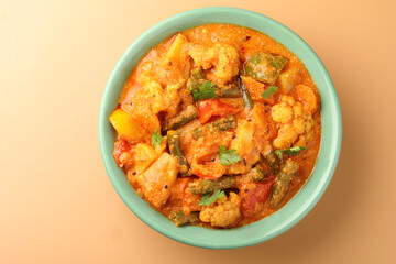 Mix vegetable curry - Indian main course recipe contains Carrots, cauliflower, green peas and beans and served in ceramic bowl