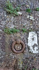 Fototapeta premium Close-up of a stone wall with rectangular bricks, showing texture and ruggedness.
