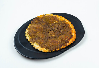 Manakeesh, arabic pizza, flat bread topped with zaatar spices close up. Homemade mediterranean flat bread manakish for breakfast
