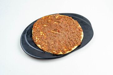 Manakeesh, arabic pizza, flat bread topped with zaatar spices close up. Homemade mediterranean flat bread manakish for breakfast
