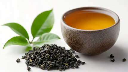 Tea leaves and teacups on white background, tea ceremony concept
