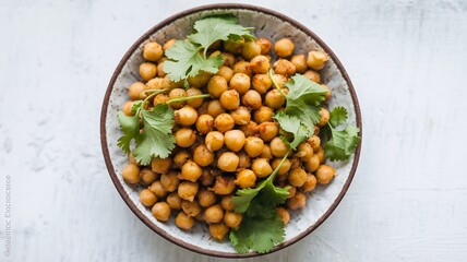 A bowl of roasted chickpeas with fresh cilantro. A healthy and delicious snack.