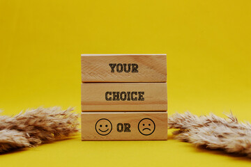 Your Choice written on wooden blocks with yellow background. Conceptual patience is power symbol....