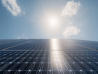 A solar panel farm stretching out under a sunny sky for converse of energy from sunlight into electricity.