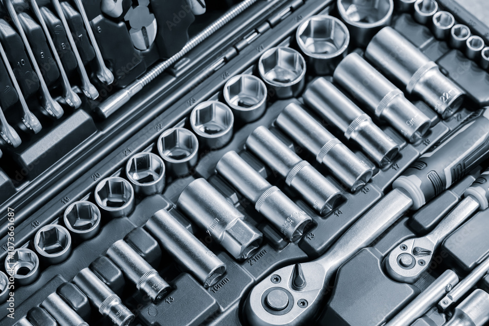 Poster A toolbox with many different sized tools. The toolbox is black and white. The tools are arranged in rows and columns