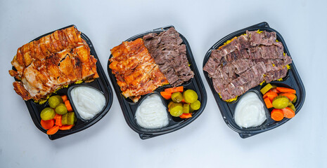 Close up of chicken shawarma meal with lettuce, tomato and onion on white background.

