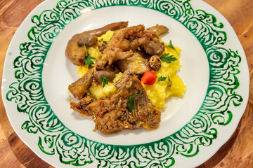 Traditional and rustic Brazilian dish, free-range chicken with polenta. Real food