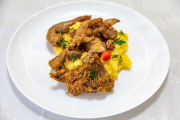 Traditional and rustic Brazilian dish, free-range chicken with polenta. Real food