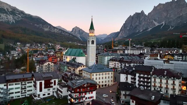 Cortina d Ampezzo village in the Dolomites in Italy at sunrise, beautiful famous Italian alpine town of Cortina, Winter Olympics site, travel in the Dolomites