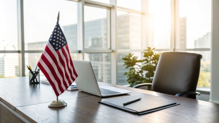 A desk with a laptop, a potted plant, and a flag