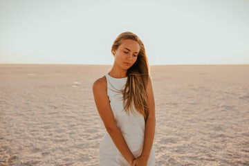 portrait of young tanned blonde European woman