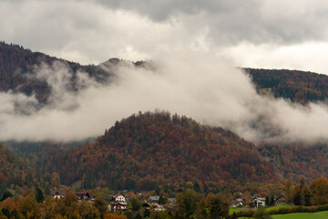 Hill over the village, covered with clouds