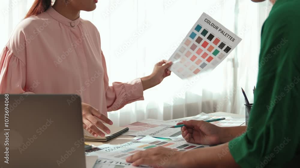 Poster slow motion two designer brainstorming and choosing color for graphic design working or client compa