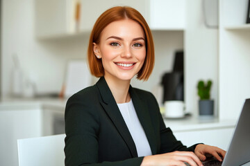 Young professional woman with red short hair in a dark green suit working in a contemporary office. Copy space.