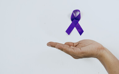 Hands holding Purple ribbons world cancer day concept, Alzheimer disease, Pancreatic cancer,...