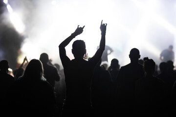 Fototapeta premium Crowd at concert and blurred stage lights.