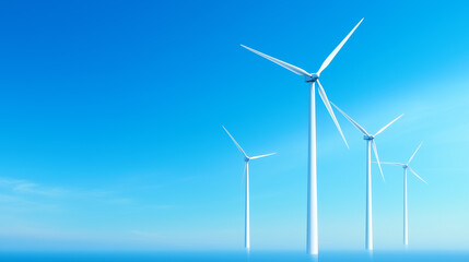 Wind turbines standing tall against a clear blue sky on a sunny day near the coast