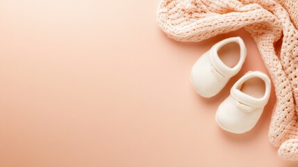 Soft baby shoes and a cozy blanket on a peach background create a warm, inviting scene, AI