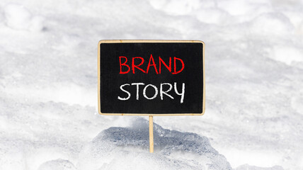 Brand story branding symbol. Concept words Brand story on beautiful yellow chalk blackboard. Beautiful white snow background. Business brand story branding concept. Copy space.