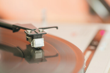 Close-up of a cartridge head on a vinyl record, analog retro music, vinyl disc collecting, vintage equipment