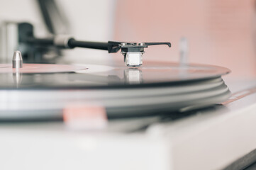 Close-up of a cartridge head on a vinyl record, analog retro music, vinyl disc collecting, vintage equipment