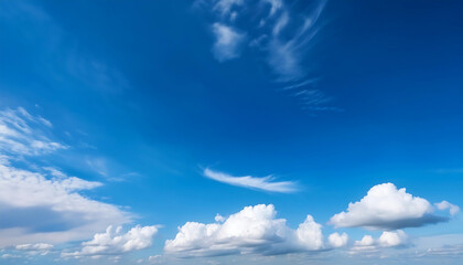 Obraz premium A clear blue sky with white clouds serves as a natural and serene backdrop for presentation_1(26)