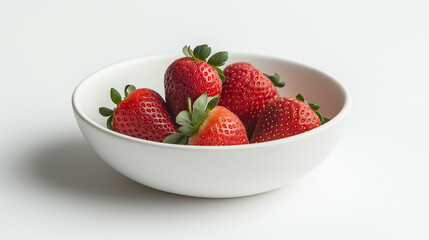 Fresh strawberries on a plate and in a bowl with milk
