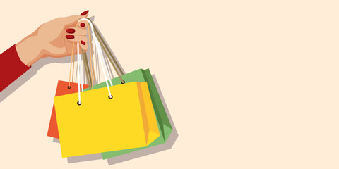 A hand gripping colorful shopping bags on a pastel background. Vector illustration