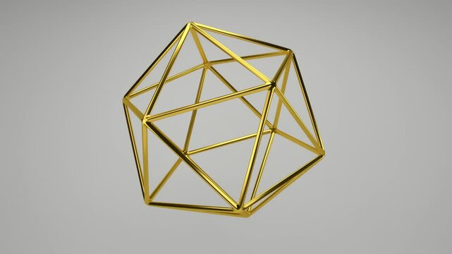 Realistic 3D rendering of a golden icosahedron slowly rotating on its axis. Beautiful backdrop with the geometric shape of the Platonic solids. Looped footage.