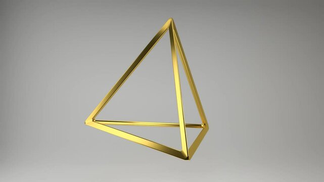 Realistic 3D rendering of a golden tetrahedron frame slowly spin around. Beautiful backdrop with the geometric shape of the Platonic solids. Looped footage.