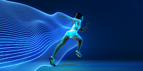 Back view of athletic young woman in white sportswear in motion, running against blue background...
