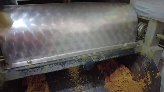 Poppy seeds are roasted and then crushed in a machine. 