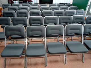 Obraz premium Seating Rows Set Up in the Hall for Upcoming Event.